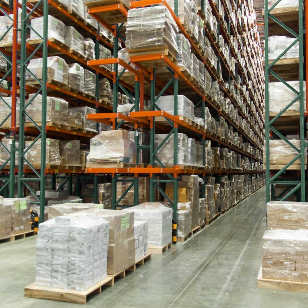 Rows of racking storing pallets in a warehouse