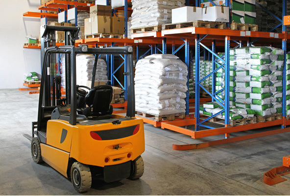 yellow forklift in distribution center