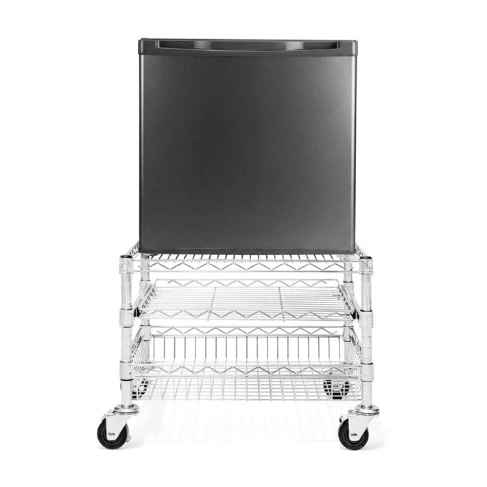 Black refrigerator on a wire cart with wheels on a white background