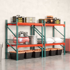 Storage room with pallet rack and various items against a white wall.