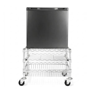 Black refrigerator on a wire cart with wheels on a white background