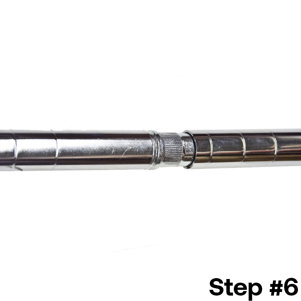 Final step of installing a post extension kit for 1-inch diameter wire shelving post, with the chrome kit securing the shelving posts into one continuous post.