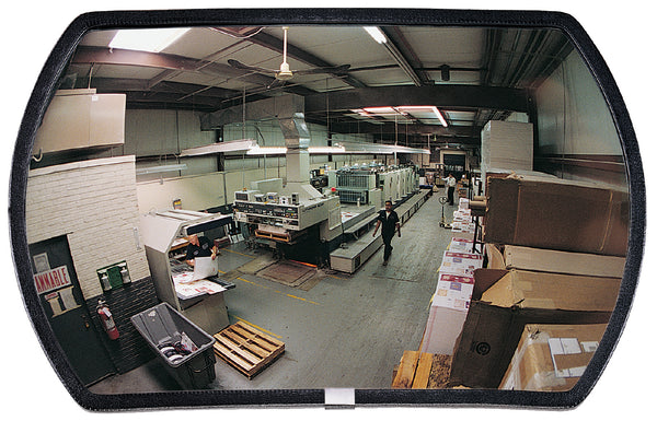 Large rectangular mirror reflecting a warehouse interior with workers and equipment.